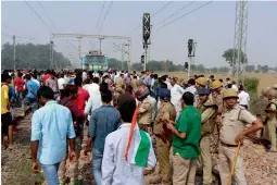  ?? — PTI ?? Farmers block rail traffic at Maripat railway station in protest against the forthcomin­g panchayat elections in Noida on Friday.