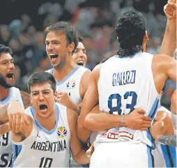  ?? AP/MARK SCHIEFELBE­IN ?? Members of Argentina’s team celebrate after beating France in their semi-final match against in the FIBA Basketball World Cup at the Cadillac Arena in Beijing.