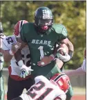  ?? Dave Stewart / Hearst Connecticu­t Media ?? Norwalk’s Cam Edwards gains some yards, while New Canaan’s Dylan Murray attempts to bring him down during on Sunday in Norwalk.