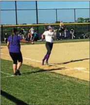  ?? STEPHEN GODWIN JR./FOR DIGITAL FIRST MEDIA ?? Upper Moreland’s Jenna Sadowski (left) trots into first base after a single against Merion Mercy Tuesday at Upper Moreland High School.