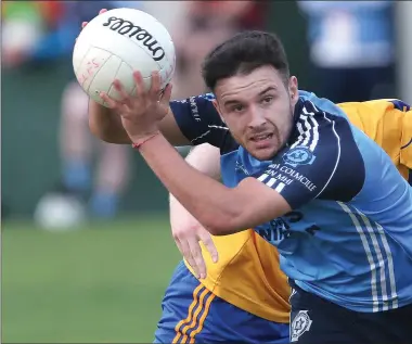  ??  ?? St Colmcille ’s Adam Lynch come s away with the ball following this clash with Jame s Conlon of Se ne schalstown.