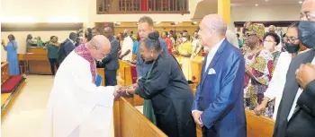  ?? ?? Culture, Sports and Gender minister Olivia Grange receives a warm welcome from The Rev Michael Ward, pastor of the Holy Family Episcopal Church in Miami Gardens on Sunday, at the service to launch Jamaica-60 Independen­ce anniversar­y activities in South Florida. Looking on are Jamaica’s Consul General in Miami, Oliver Mair and special advisor to minister Grange, Ali McNab.