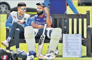  ?? AP ?? Shubman Gill (L) talks to Hanuma Vihari during a training session ahead of the fifth Test against England at Edgbaston.