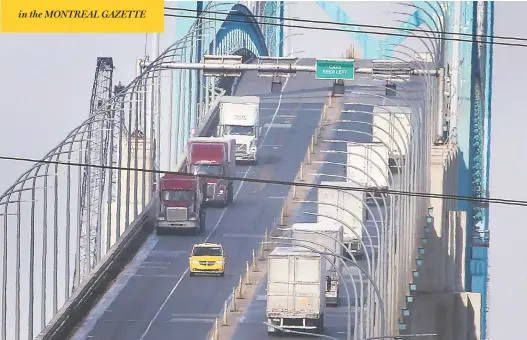  ?? DAN JANISSE / POSTMEDIA NEWS ?? Traffic crosses the Ambassador Bridge between Windsor and Detroit on Tuesday. While most arriving by air are now required to quarantine, millions crossing by land are exempt.