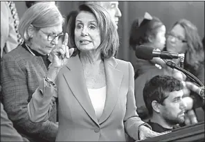  ?? AP/JACQUELYN MARTIN ?? After the vote Tuesday, House Minority Leader Nancy Pelosi said the Republican tax bill is a “disgusting smash-and-grab. It’s an all-out looting of America, a wholesale robbery of the middle class.”