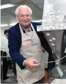  ??  ?? US AMBASSADOR DAVID FRIEDMAN volunteers at Pantry Packers... as does this smiley young boy!