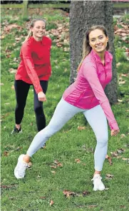  ??  ?? Madeleine Howell, left, and Lucy WyndhamRea­d work out at Farnham Park, Surrey