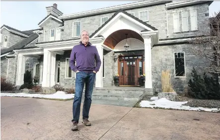  ?? CHRISTINA RYAN ?? Jim Quinn, founder of QuinnCorp Communitie­s, stands in front of his luxurious, spacious home in the city’s southwest.