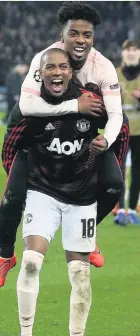  ??  ?? Angel Gomes and Ashley Young after the win over Paris St Germain