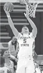  ?? AP ?? Florida State’s Balsa Koprivica scores a basket against UNC-Greensboro in a first-round game Saturday.