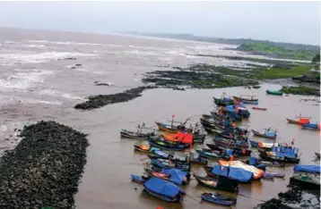  ??  ?? Left: A man-made cove shields fishing vessels from incoming tides. Far left: The catch of the day cooked Malvani style. Below right: 14th century temple is remarkably wellpreser­ved