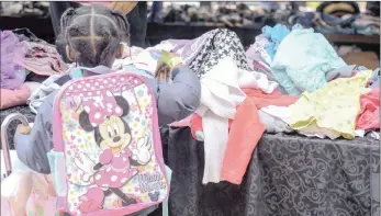  ?? PICTURES: PIPPA ROWNEY ?? Homeless adults and their children were also able to choose a bag of new clothes at the Street Store event at Dennis Hurley Centre in Durban where 1 400 people who live on the streets were treated to a day of pampering, from pedicures to haircuts.