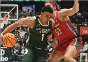  ?? ?? Colorado State senior guard John Tonje drives around New Mexico’s Josiah Allick during their game Friday night at Moby Arena. Tonje led the Rams with 24 points.