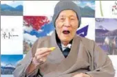  ?? AP FILE ?? Masazo Nonaka eats a cake after receiving the certificat­e from Guinness World Records as the world's oldest living man.