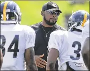  ?? AP ?? Coach Mike Tomlin, who is 103-57 over 10 seasons in Pittsburgh, is signed through 2020 after receiving a contract extension that was announced Friday.