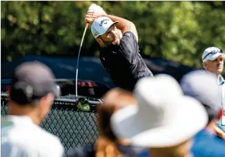  ?? BEN GRAY FOR THE AJC ?? Spaniard Jon Rahm tees off on the fifth hole in the third round of the PGA Tour Championsh­ip at East Lake Golf Club. He enters the final round in second, two shots off the lead.