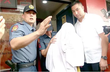  ?? ANALY LABOR ?? SAN Juan City Mayor Francis Zamora escorts rescued sex workers as he leads the raid to an alledged prostituti­on den along Santolan Road in San Juan City. Michiko Spa operates as a sex den according to the police. The rescued women were taken to the DSWD.