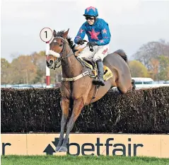  ??  ?? Easy does it: Cue Card on his way to an impressive 15-length win in the Betfair Chase