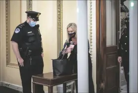  ?? ASSOCIATED PRESS ?? IN THIS JAN. 12 FILE PHOTO, Rep. Marjorie Taylor Greene, R-Ga., passes through a metal detector before entering the House chamber, a new security measure put into place after a mob stormed the Capitol in Washington.