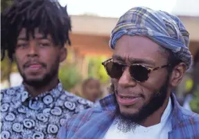  ?? SCHALK VAN ZUYDAM/AP ?? Yasiin Bey, formerly known as Mos Def, right, moved to South Africa to escape racism, though he was thrown out in 2016.