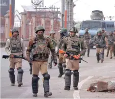  ?? — Reuters ?? Central Reserve Police Force (CRPF) personnel patrol a street in downtown Srinagar on Saturday.