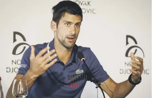  ??  ?? 0 Novak Djokovic gestures to reporters in Belgrade yesterday as he announces that he will take part in no further tournament­s this year.