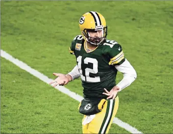  ?? Stacy Revere / Getty Images ?? Packers QB Aaron Rodgers gestures after throwing a touchdown pass in Monday’s win over the Falcons. Green Bay has scored an NFL-best 152 points through four games.