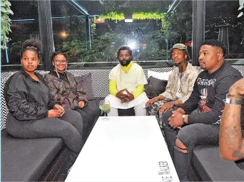  ?? / Bongiwe Mchunu ?? Sjava and Emtee, third and fourth from left, with entourage at K.O’S album launch at Rockets in Bryanston.
/ Photos