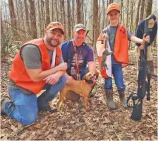  ?? PHOTO CONTRIBUTE­D BY LARRY CASE ?? From left, Wilson Scott, Jamie McCarson and 9-year-old Walker Scott are all smiles as they pose with Sage the squirrel hunting dog during the recent Squirrel Master Classic near Montgomery, Ala. Walker is a 4-H competitiv­e shooter.