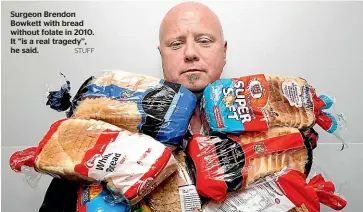  ?? STUFF ?? Surgeon Brendon Bowkett with bread without folate in 2010. It ‘‘is a real tragedy’’, he said.