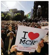  ?? EMILIO MORENATTI / ASSOCIATED PRESS ?? Crowds gather for a vigil in Albert Square, Manchester, England, on Tuesday, the day after a suicide attack at an Ariana Grande concert left 22 people dead.