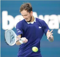  ?? AP Photo/Wilfredo Lee ?? ■ Daniil Medvedev of Russia returns a shot from Jenson Brooksby on Tuesday during the Miami Open tennis tournament in Miami Gardens, Fla.