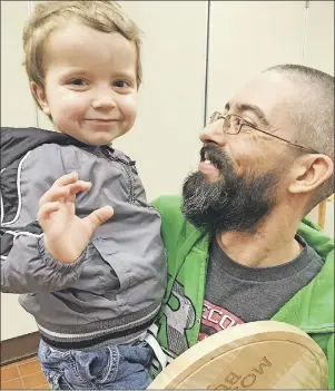  ?? DAVE STEWART/THE GUARDIAN ?? Chef Stephen Wilson celebrates his Burger Love win with his son, Gabe, on Thursday. Wilson and his team served up 2,676 burgers at Mill River Experience in April.