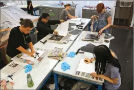  ?? Katharine Lotze/The Signal ?? California State Summer School for the Arts students make prints in a studio at California Institute of the Arts in Valencia on Wednesday.