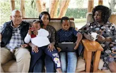  ?? REUTERS ?? JOSHUA Babu and his wife Emily Chelangat, who lost their son and daughter-in-law to the Ethiopian Airlines Flight 302 crash, sit with family members. | NJERI MWANGI