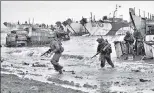  ?? WIKIMEDIA COMMONS ?? British commandos on Jig Green beach during the invasion of n
Normandy in France on June 6, 1944.