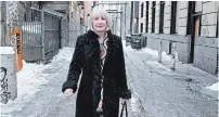  ?? JONATHAN HAYWARD THE CANADIAN PRESS ?? Federal Health Minister Patty Hajdu walks through a back alley after visiting the Molson Overdose Prevention Site in Vancouver's Downtown Eastside, Thursday.