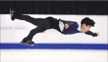  ?? AP ?? Nathan Chen performs in the free program during Skate Canada on Oct 30 in Vancouver. The American, 22, has been in impressive form in the build-up to Beijing 2022.