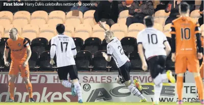  ??  ?? First blow
Harry Davis celebrates netting the opener