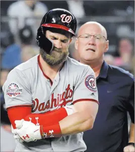  ?? Bill Kostroun ?? The Associated Press Washington Nationals outfielder Bryce Harper reacts after being hit by a pitch by New York Yankees pitcher CC Sabathia during the fifth inning on Tuesday.