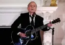  ?? Photograph: Evelyn Hockstein/ Reuters ?? Singer Paul Simon provides the entertainm­ent after a sumptuous formal state dinner, opening his set performanc­e with Graceland