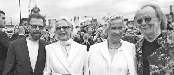  ?? GETTY IMAGES ?? Björn Ulvaeus, Anni-frid Lyngstad, Agnetha Fältskog and Benny Andersson say hello to the waiting fans ahead of the first performanc­e of ABBA’S “Voyage” at ABBA Arena on May 26 in London.