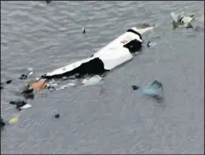  ?? KRIV FOX 26 ?? A video image shows debris Saturday in Trinity Bay, just north of Galveston Bay and the Gulf of Mexico, in Texas.