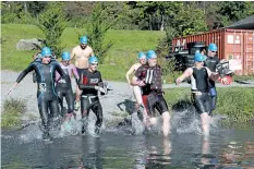  ?? LAURA BARTON/WELLAND TRIBUNE ?? Eight participan­ts take the plunge into the Welland Recreation­al Canal after the horn blows to start the SwimRun Challenge held at the PenFinanci­al Credit Union Flatwater Community Centre in Welland on Saturday morning by Canaqua Sports. Unlike...