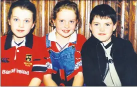  ?? ?? St Catherine’s fans Finola Neville, Fiona Cotter and Daniel O’Brien, all from Ballynoe at the presentati­on of medals to Loreto camogie players in Fermoy.