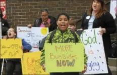  ?? PHOTOS BY JOHN BERRY — THE TRENTONIAN ?? Dozens gathered in front of the Trenton Board of Education building Monday before the board meeting to demand action from the district to help protect students on buses who have been victims of assaults in recent months.