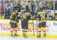  ?? HERALD PHOTO BY JIM MICHAUD ?? PLENTY TO WORK ON: Claude Julien speaks to his team during last night’s exhibition in Providence.