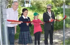  ??  ?? The official ribbon cutting...(from left) Paul McArdle of Bike On New Zealand Charitable Trust, St Marcellin student Sandra Fernandez, Tawhero School student Anna Falconer and Mayor Hamish McDouall