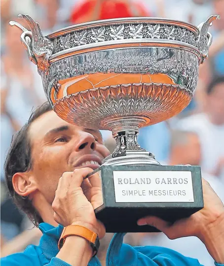  ?? Picture: AP. ?? Rafael Nadal with the French Open silverware after his 11th victory in Paris since his debut in 2005.