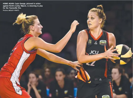  ?? HOME AGAIN: Cayla George, pictured in action against Perth’s Carley Mijovic, is returning to play for the Townsville Fire. Picture: WESLEY MONTS ??